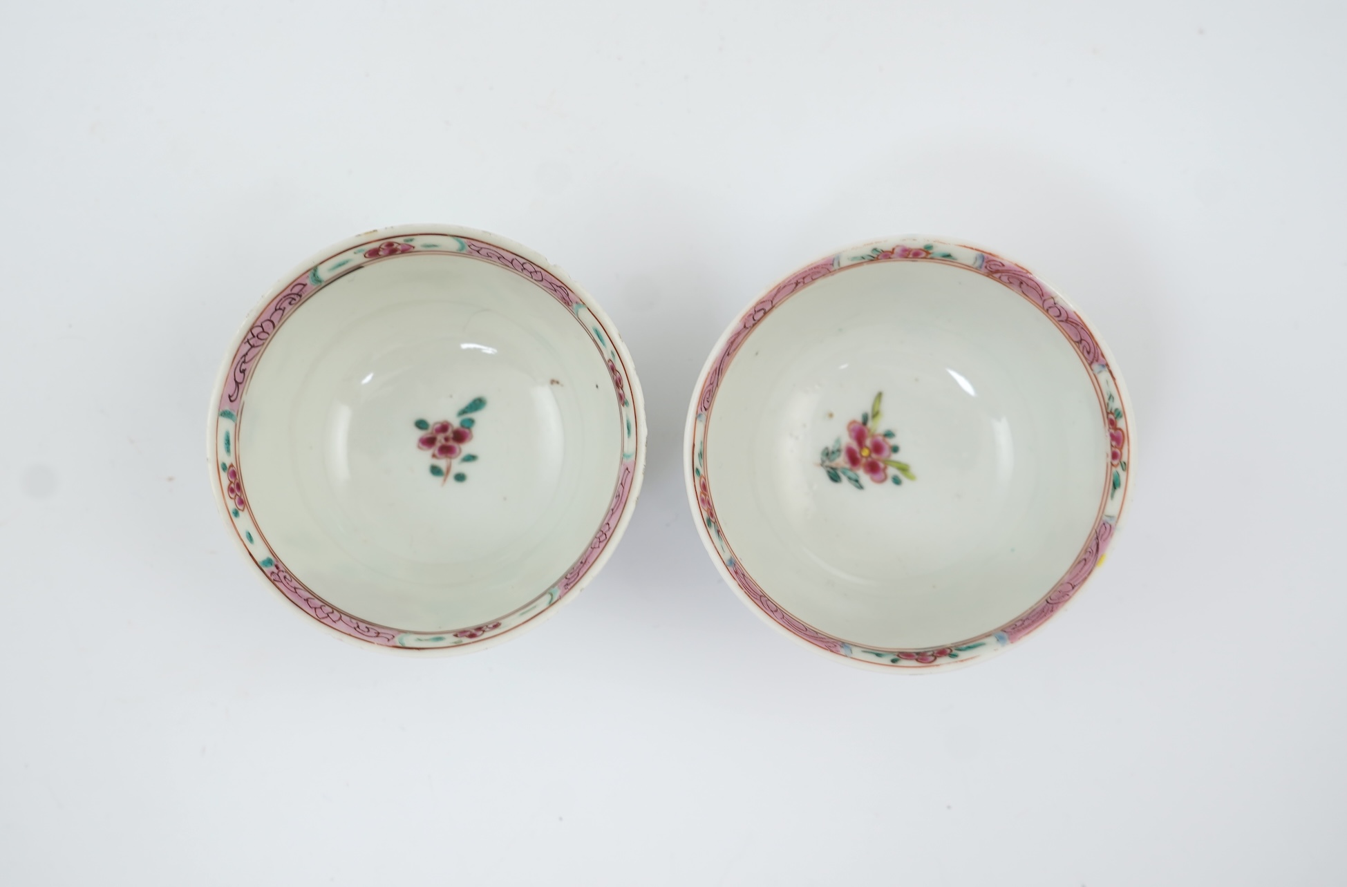 A near pair of Chinese famille rose ‘cockerel’ tea bowls and saucers, Yongzheng period